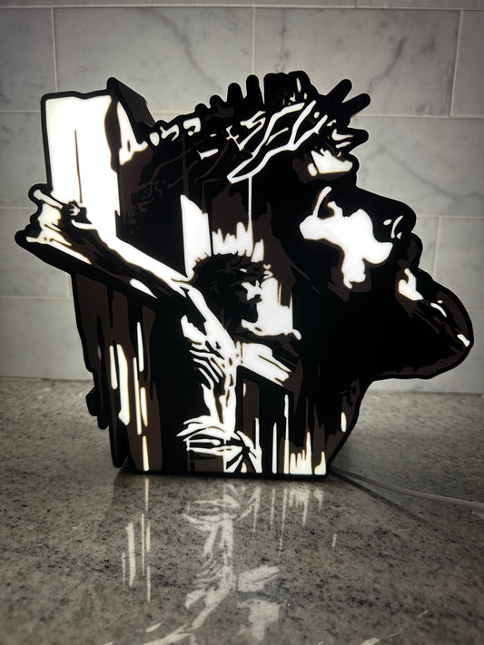 Back Light image of Christ on and Cross and looking up